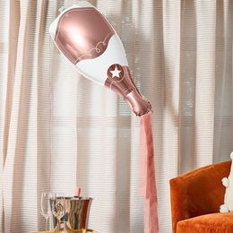 Bildspel - Folieballong Champagneflaska Roséguld med Streamers