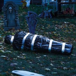 Diaesitys - Ruumis Mustassa Muovisäkissä