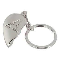 Lysbildefremvisning - Nøglering Halvt Hjerte med Bogstav