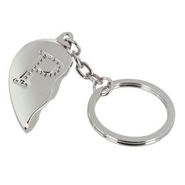 Lysbildefremvisning - Nøglering Halvt Hjerte med Bogstav