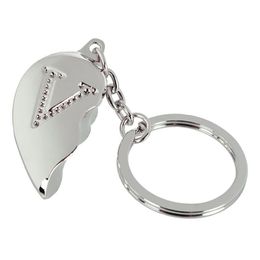 Lysbildefremvisning - Nøglering Halvt Hjerte med Bogstav